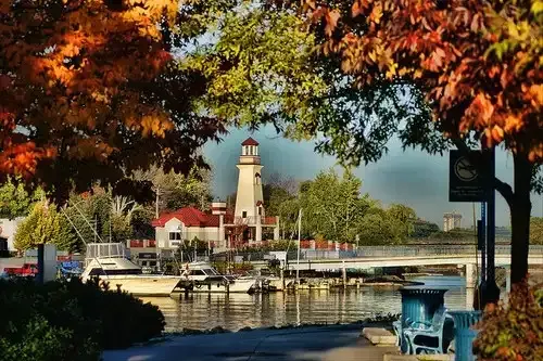 Scenic view of the Port Credit lighthouse and marina during the autumn season.