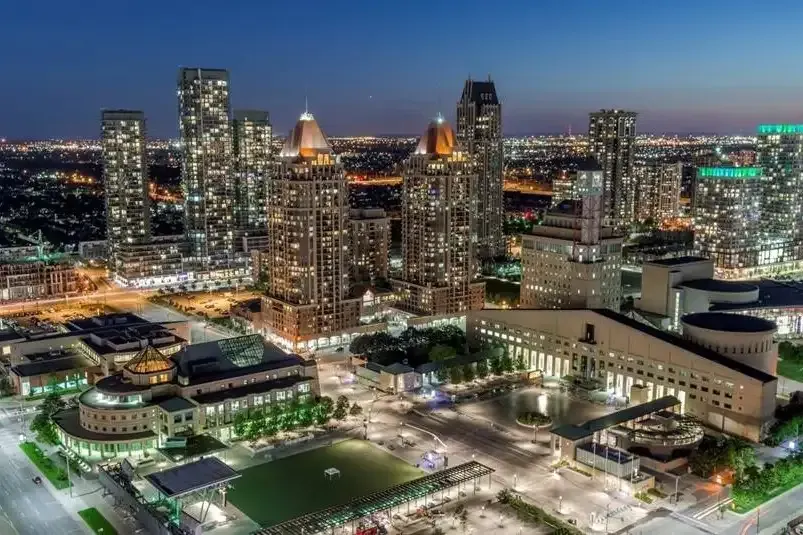 Aerial view of the Mississauga City Centre and Celebration Square at night.