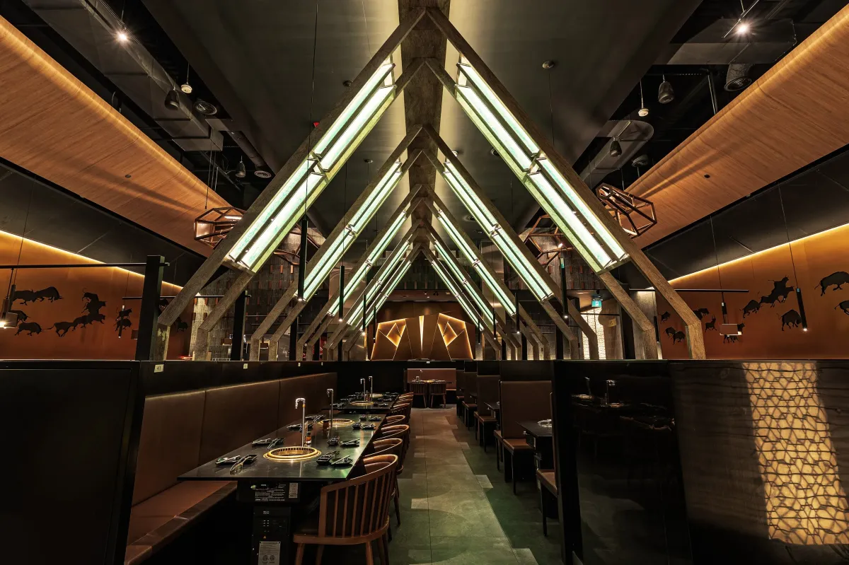 The modern interior dining area of Gyu-Kaku Japanese BBQ in Mississauga.