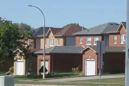 Residential street in Blue Grass Meadows, Whitby, offering great value for Mississauga commuters.