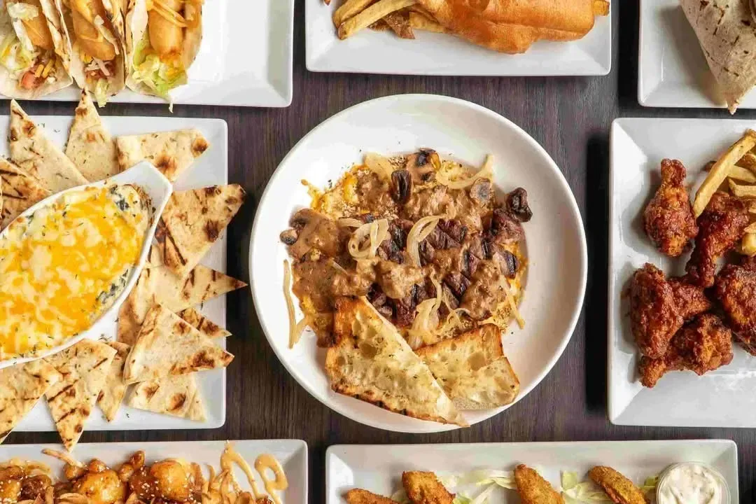 A delicious spread of pub-style appetizers and comfort food at The Copper Key in Whitby.