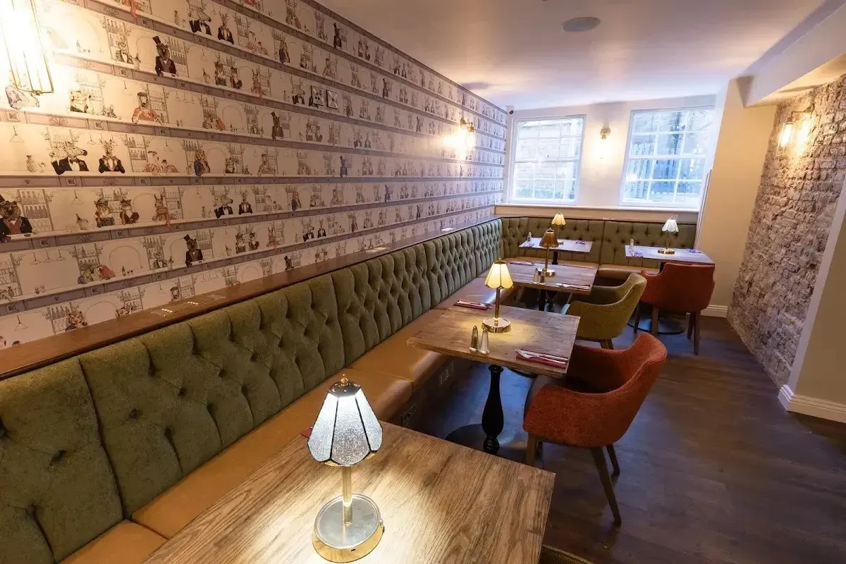 The stylish interior and cozy booth seating at The Vault Gastropub in Whitby, Ontario.