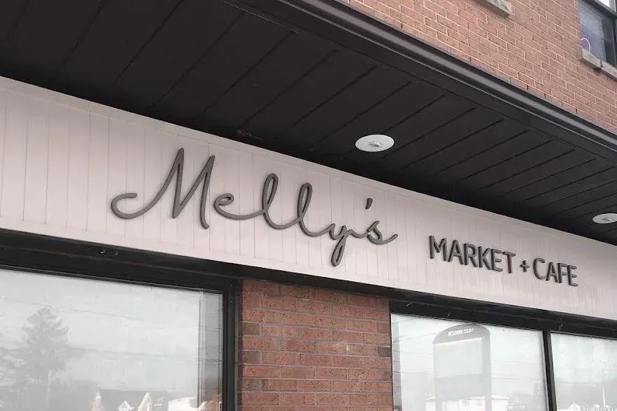 The welcoming storefront of Melly's Market + Café, a community-focused spot in Whitby.