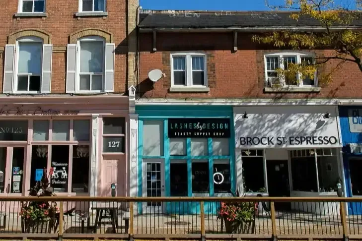 A row of vibrant local shops and colorful storefronts in the heart of Downtown Whitby.
