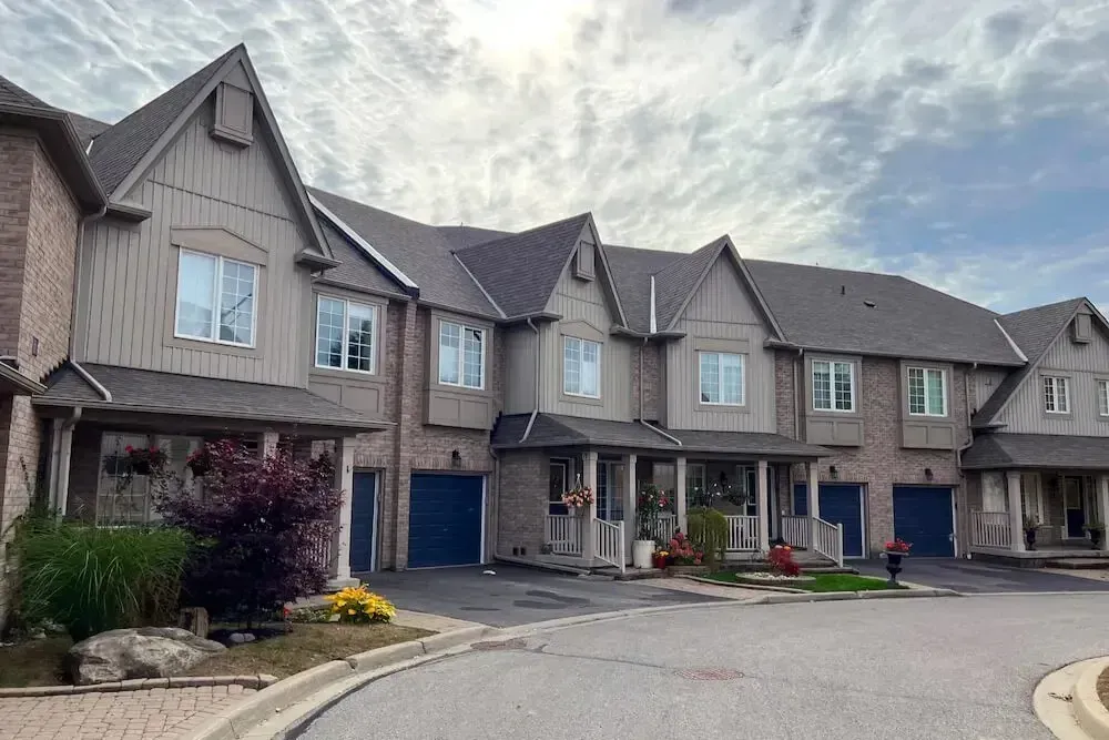 A row of classic townhomes in the West Shore neighborhood near Frenchman's Bay.