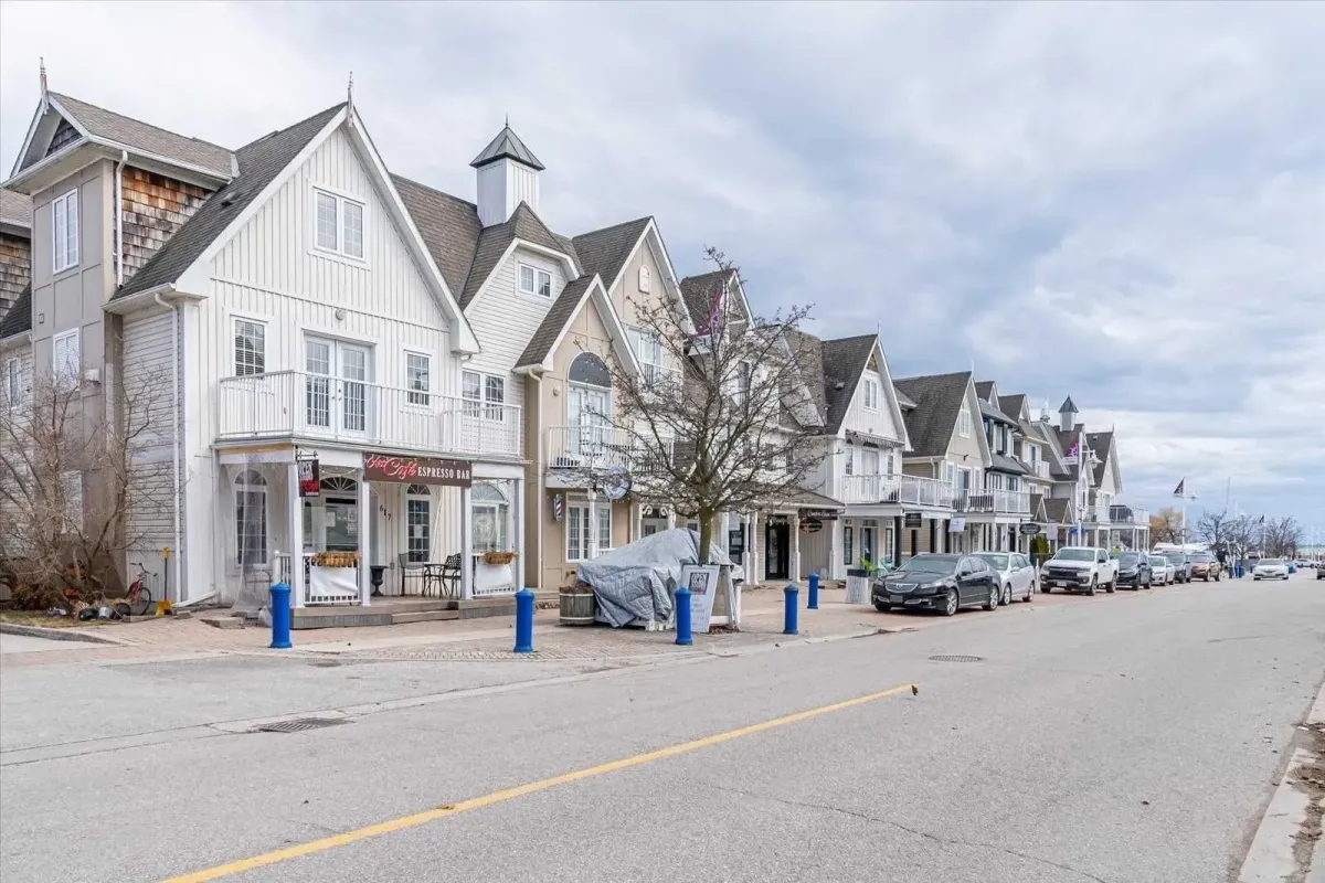 White residential buildings along the street in the Liverpool Nautical Village area.