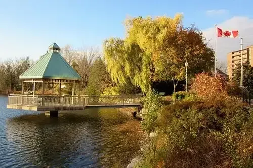 A peaceful autumn view of the gazebo and walking trails at Mill Pond Park in Milton.