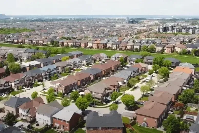 A row of contemporary detached family homes in a popular Milton neighborhood.