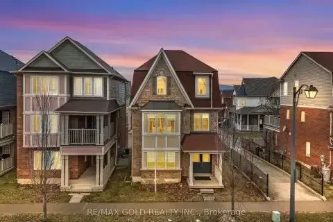 Contemporary multi-story townhouses at sunset in the Walker neighborhood.