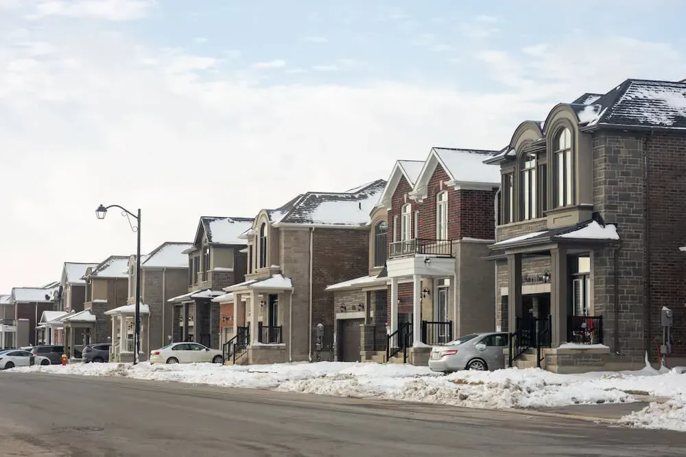 Street view of modern detached family homes in the Cobban neighborhood.