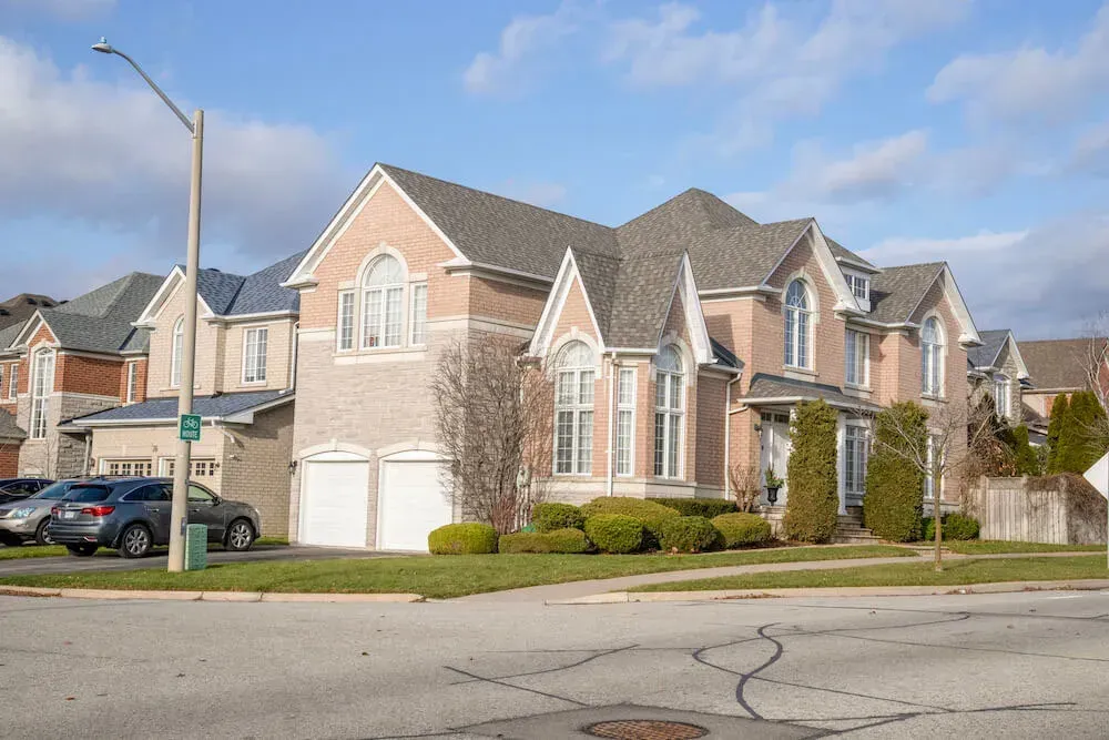 Exterior of contemporary family homes in the sought-after Rouge Woods neighborhood.