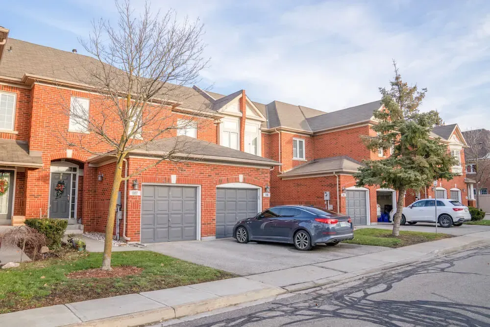 Traditional brick townhouses in the established Harding neighborhood.