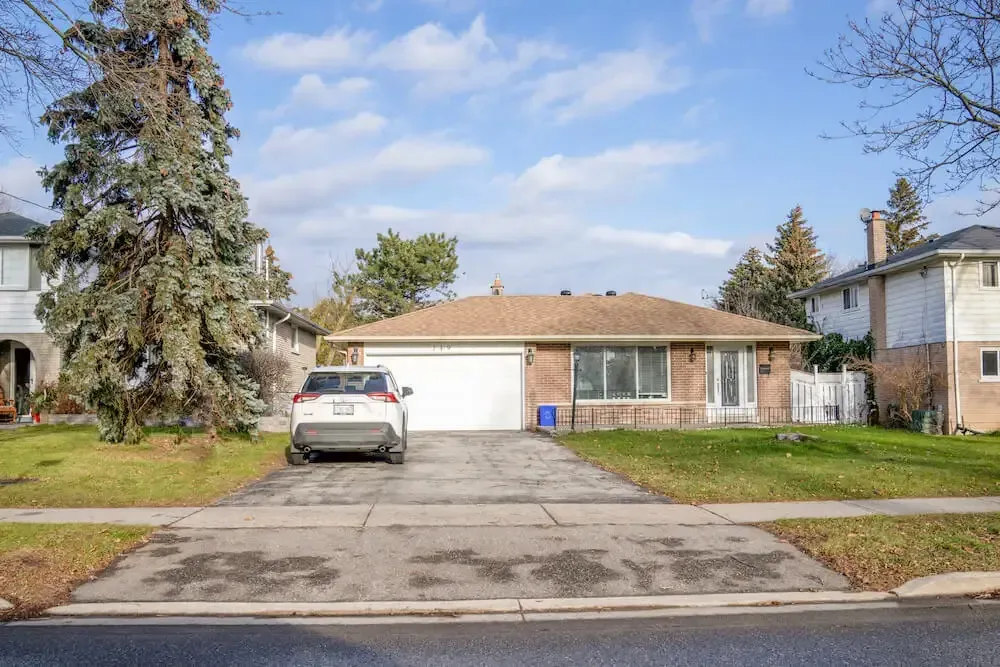 Exterior of an updated detached bungalow in the mature Crosby neighborhood.