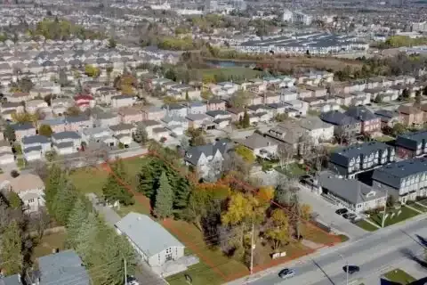 Aerial view of modern detached homes and green spaces in the Westbrook community.