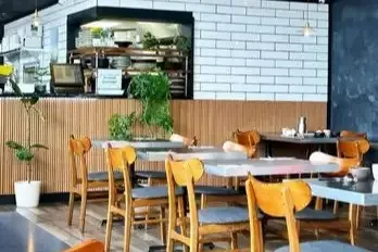 Cozy and stylish interior dining area of COTOLET restaurant in Richmond Hill.