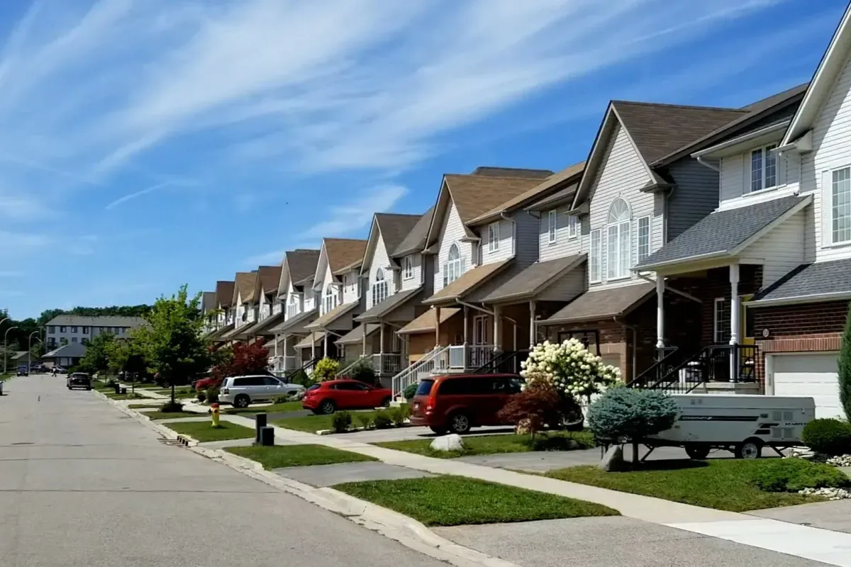 A row of modern semi-detached suburban houses in a Waterloo neighborhood.