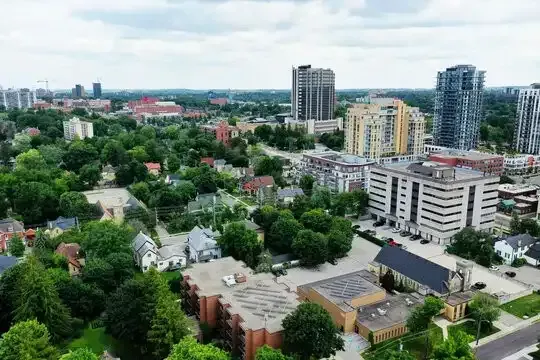 Aerial view of residential apartments and trees in Waterloo, Ontario.