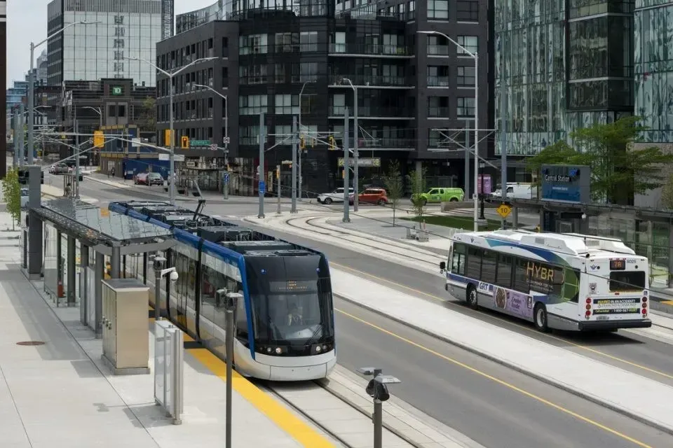 The ION light rail train stopped at a transit station in Waterloo.