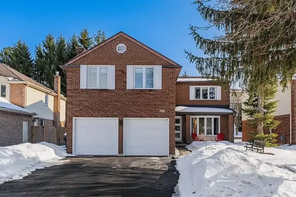 Traditional two-story brick detached houses in Westvale, Waterloo.