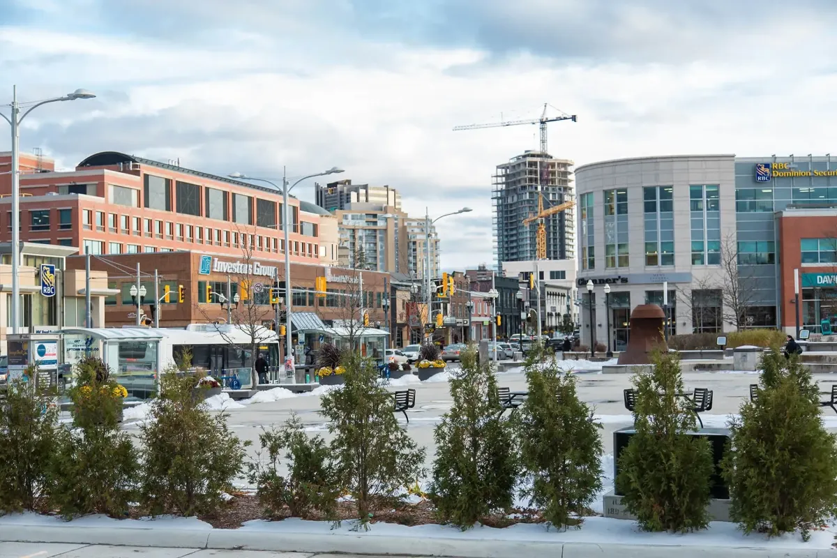 Winter street view of commercial buildings and shops in Uptown Waterloo.