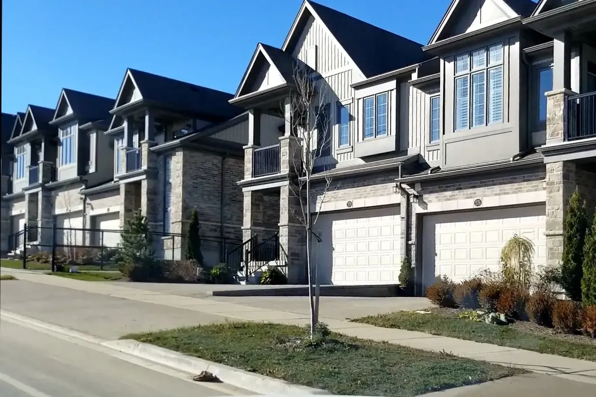 A row of contemporary luxury townhouses with garages in Vista Hills.