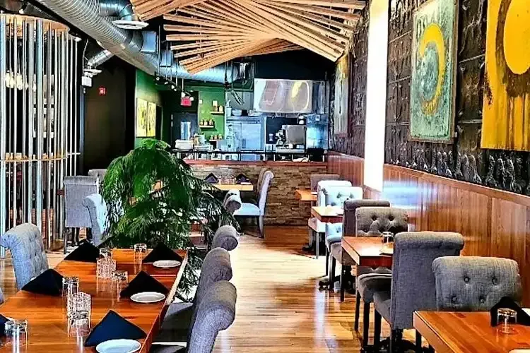 Modern interior seating and tables at Trio Restaurant in Waterloo.