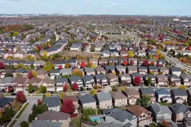 High-angle aerial view of a dense residential neighborhood in Oakville.