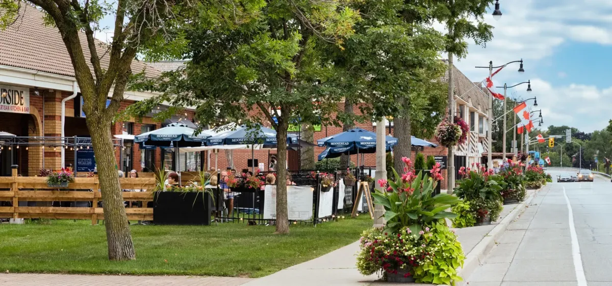 Sidewalk view of boutiques and cafes in the Bronte Village lakeside community.