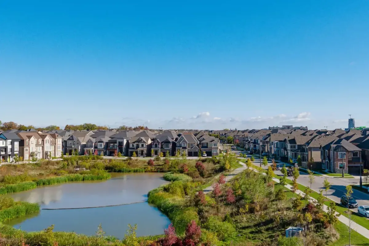 Scenic view of a community pond and newer homes in The Preserve development.