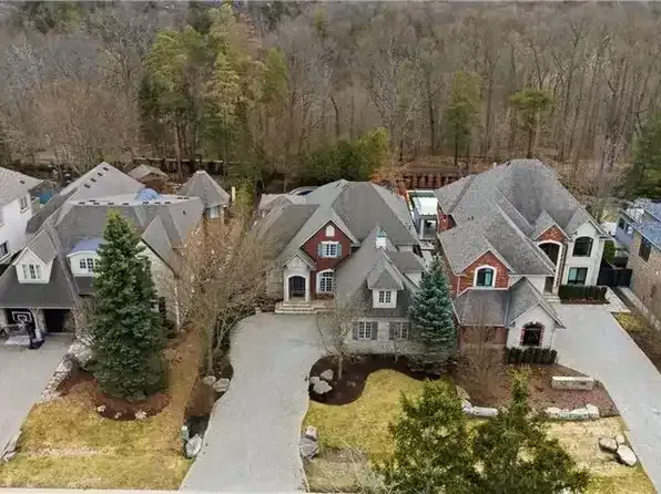 Aerial view of a well-maintained suburban street in the River Oaks community.