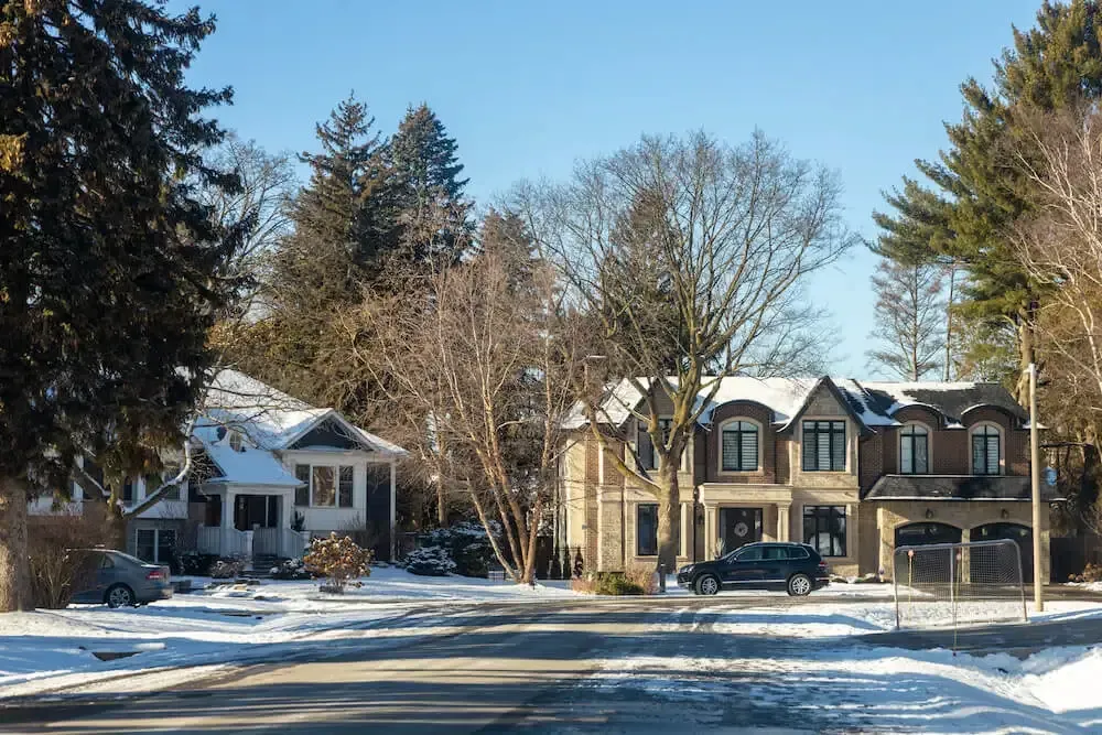 Custom residential homes and mature trees in the Southwest Oakville neighborhood.