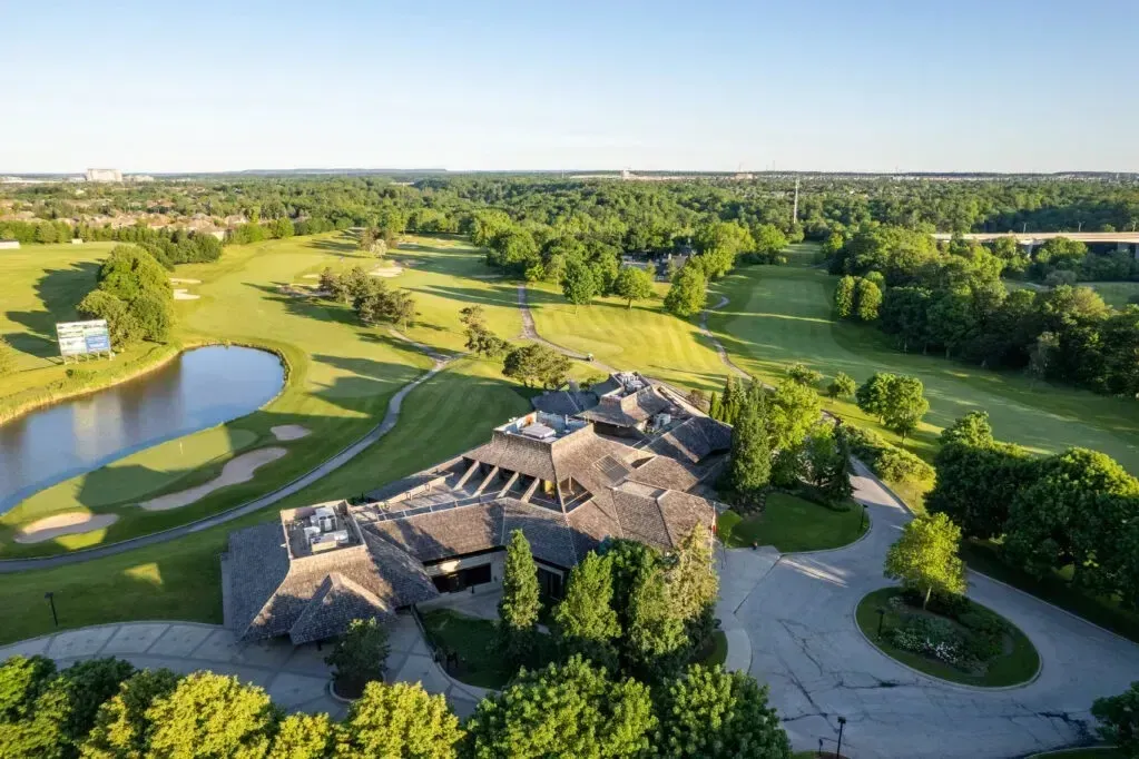 High-angle aerial view of the fairways and clubhouse at Glen Abbey Golf Club in Oakville.