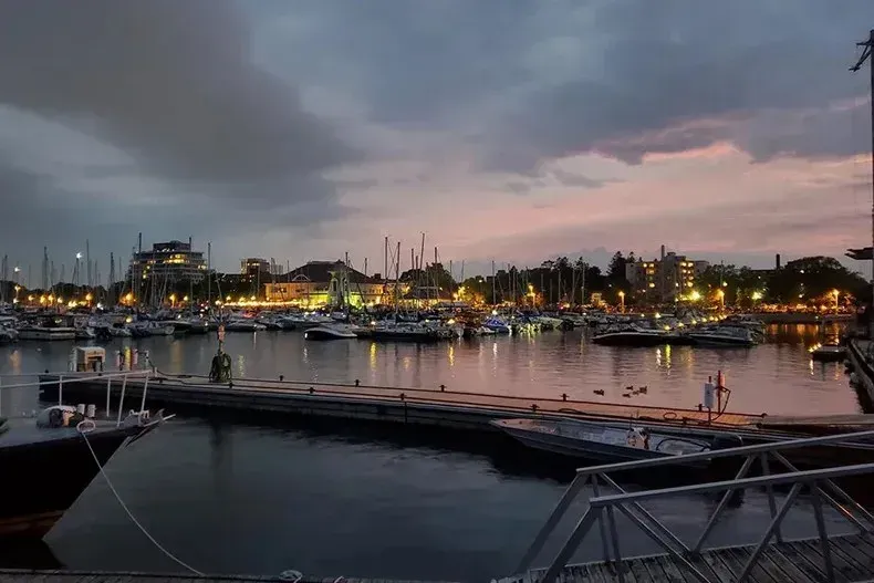 Sunset view of docked boats and the marina at Bronte Harbour in Oakville.