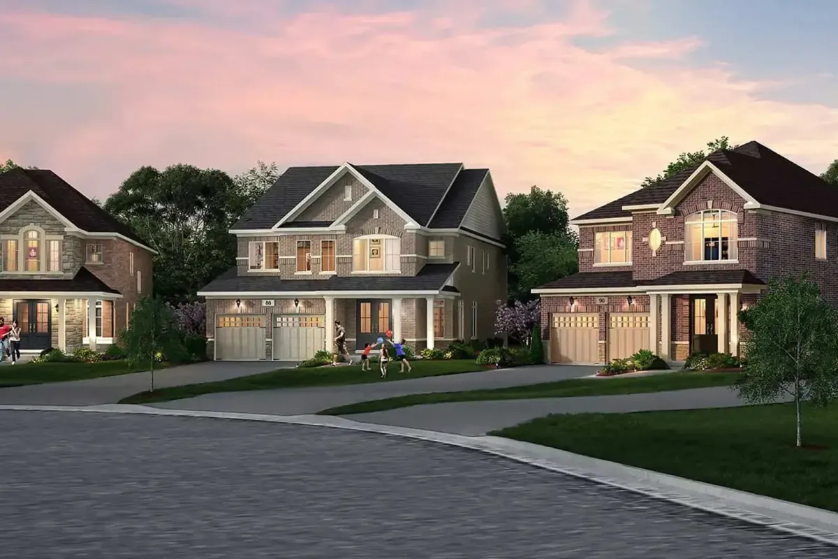 A row of modern two-story detached family homes at dusk in Caledon.