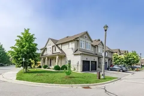 Traditional two-story detached family homes on a corner lot in Mono Mills.