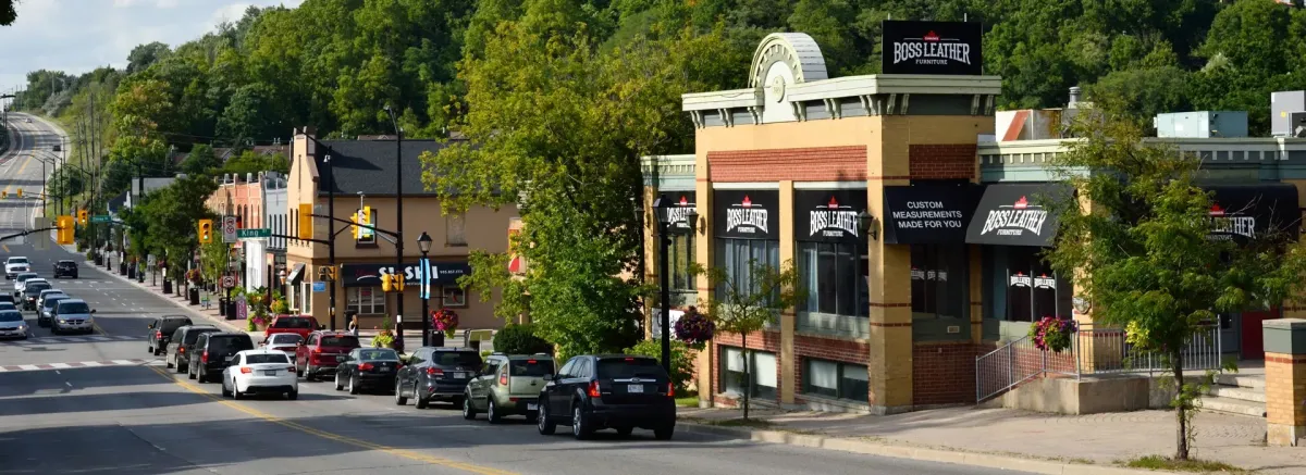 Street-level view of local businesses and boutique shops in downtown Bolton.