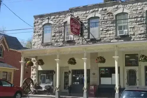 The historic stone facade of the Cheltenham General Store in the heart of the village.