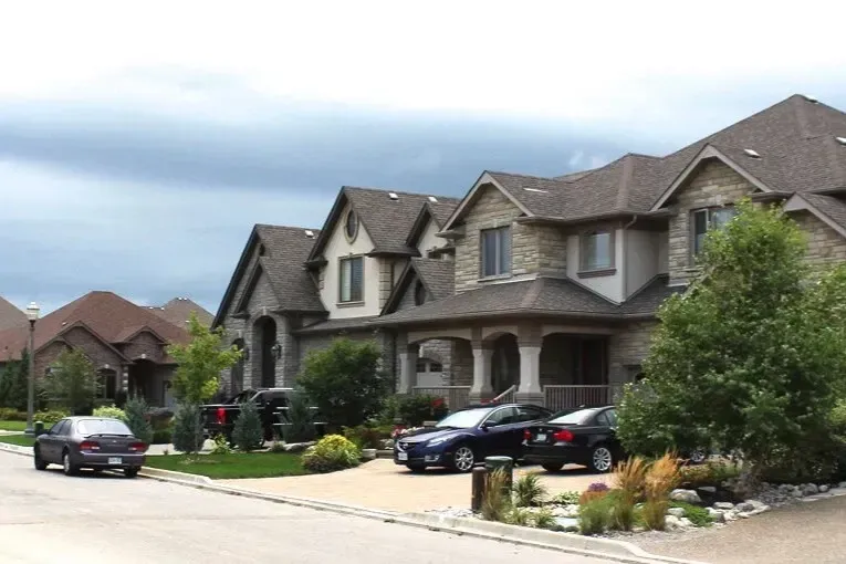 A row of modern detached suburban homes representing top neighborhoods to live in Kitchener.