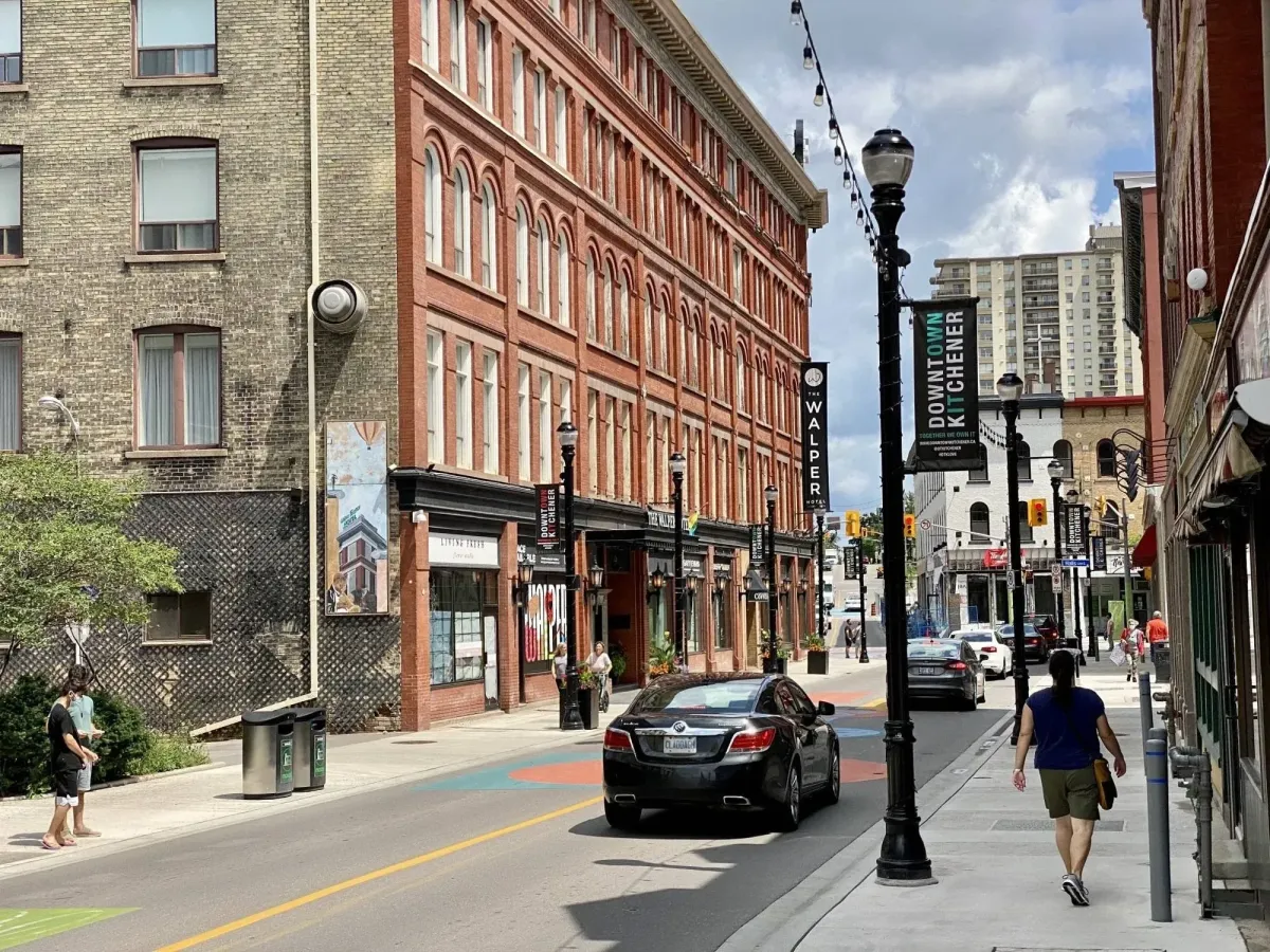 Historic brick buildings and pedestrian-friendly sidewalks in the heart of Downtown Kitchener (DTK).