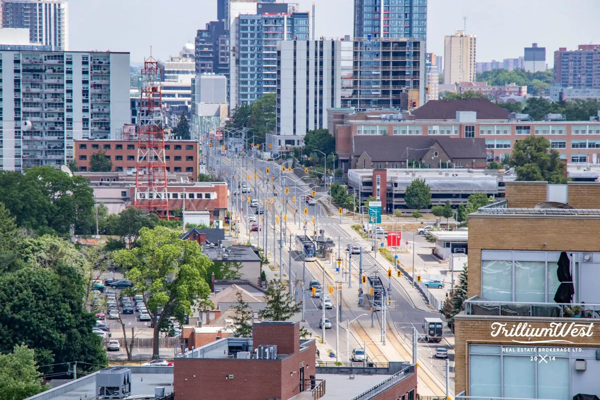 Urban street view of the Midtown Kitchener neighborhood showcasing high-rise residential buildings and city living.