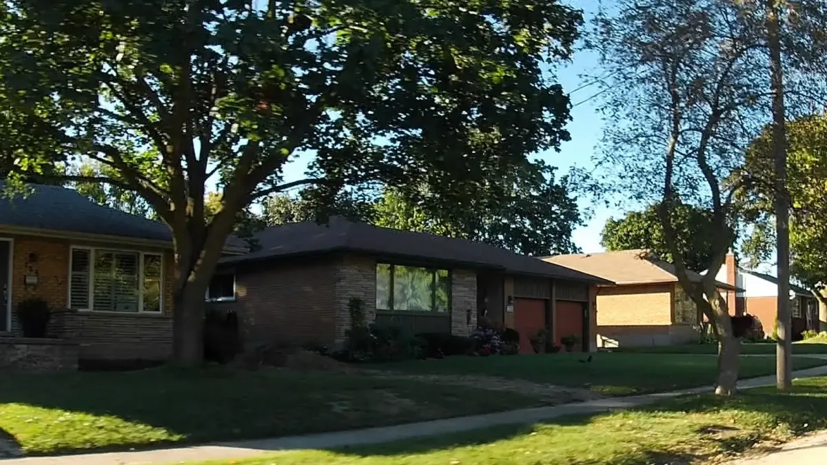 Charming bungalow-style homes in the Stanley Park area of Kitchener, highlighting its green spaces and established feel.