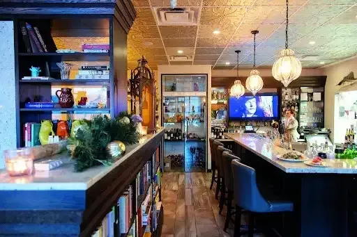 Warm and inviting interior of Public Kitchen and Bar featuring a cozy bar area and unique local decor.