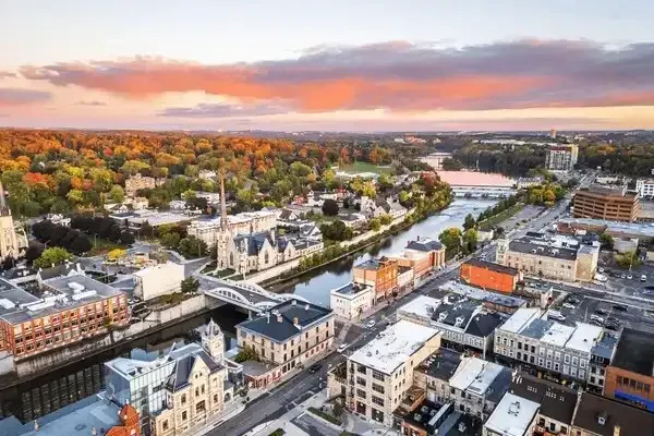 Wide-angle aerial perspective of Kitchener's urban landscape, showing a mix of residential and commercial zones.