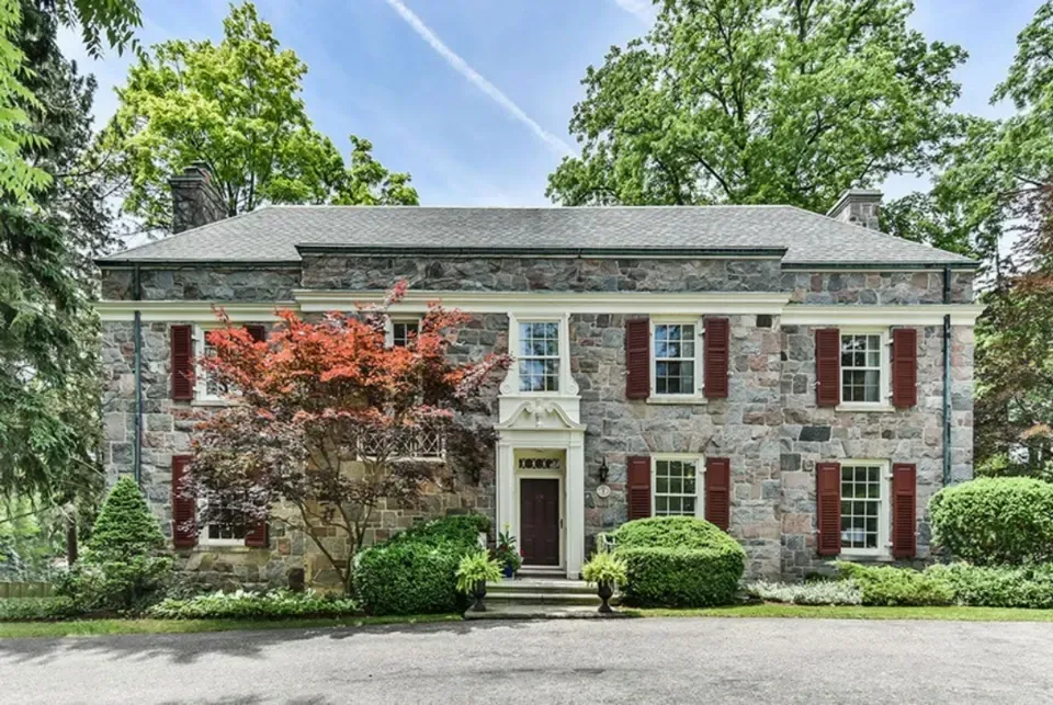 A grand historic limestone manor representing the unique architecture found in West Galt.