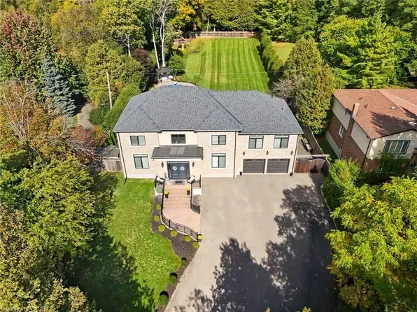 A large executive estate with professional landscaping in the upscale Fiddlesticks neighborhood.