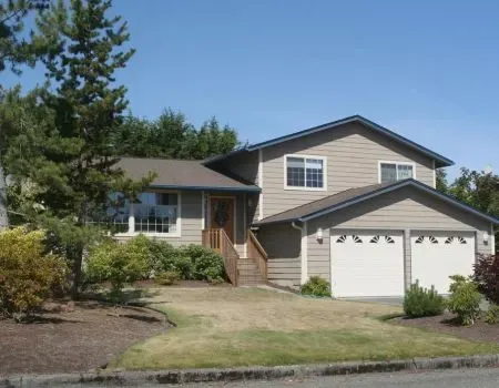 A classic split-level family residence on a spacious lot in the Langs Farm community.