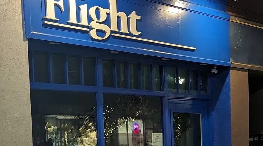 Bright blue storefront of Flight Cafe in Hespeler Village, a popular local destination for coffee and light bites.