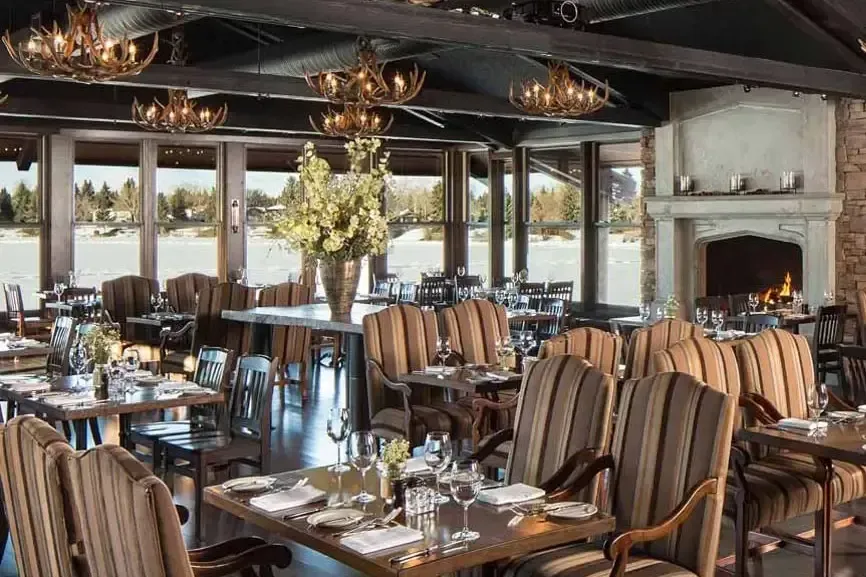 Upscale interior of a Calgary restaurant with elegant seating, highlighting the city's diverse culinary scene.