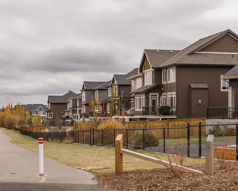 A row of upscale executive townhomes with modern architecture in the Aspen Woods neighborhood.