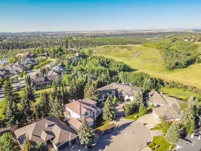 Elevated view of Canyon Meadows, highlighting the lush parkland and residential properties.